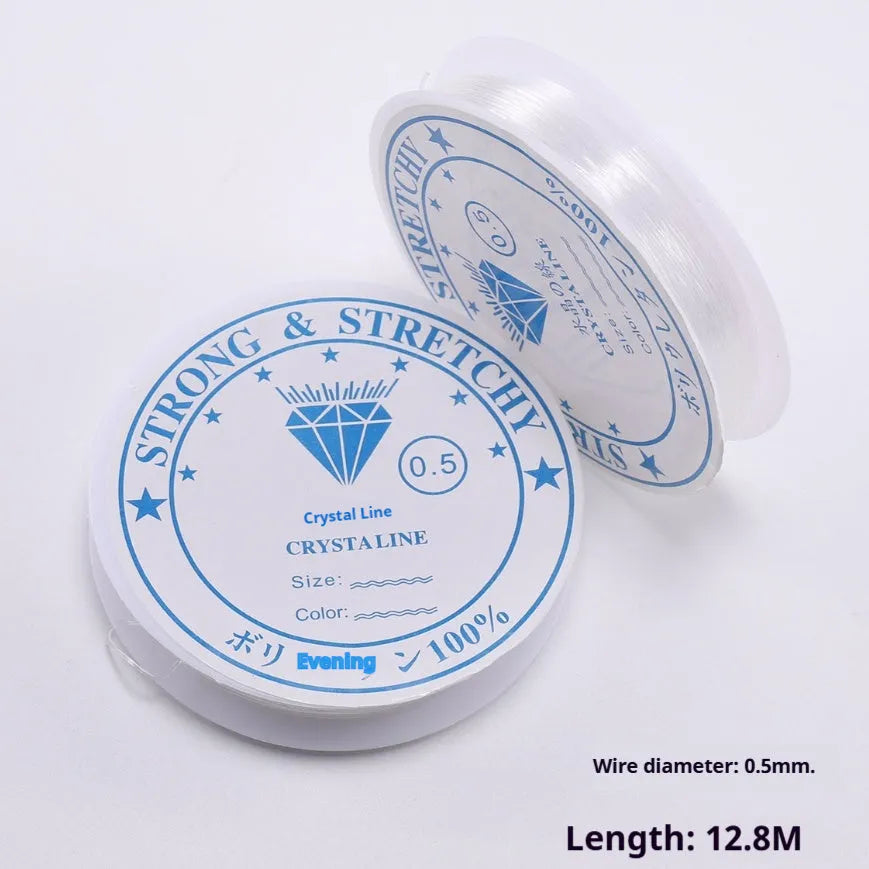 Reel of transparent white elastic fishing line for DIY crafts and jewellery.