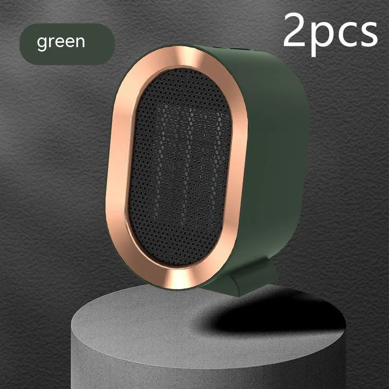 Desktop ceramic fan heater in black with mechanical control knobs and a front grille.