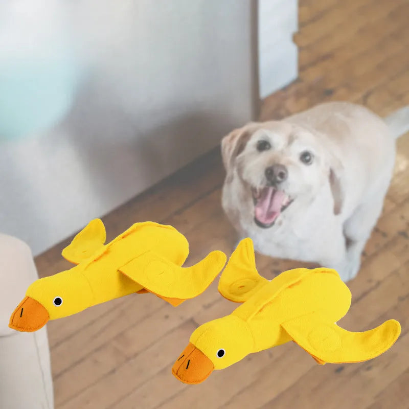 Yellow plush duck dog toy with treat compartments and squeaker for training