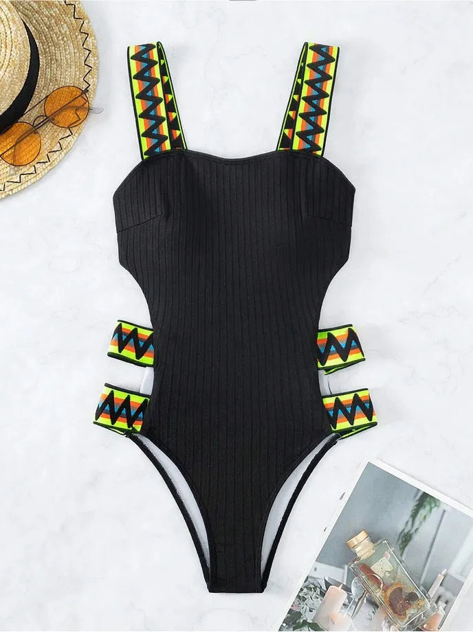 Women's solid colour one-piece swimsuit bikini in black or orange polyester fabric