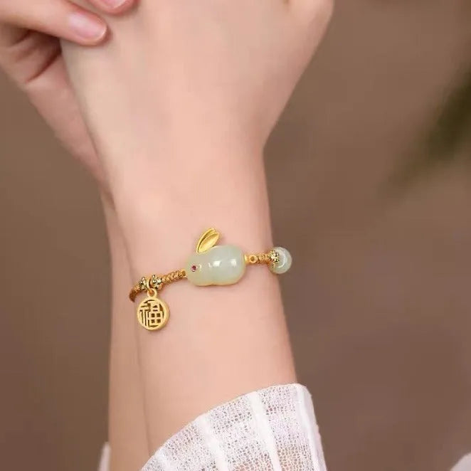 Hetian jade rabbit bracelet with geometric charm on yellow string for women