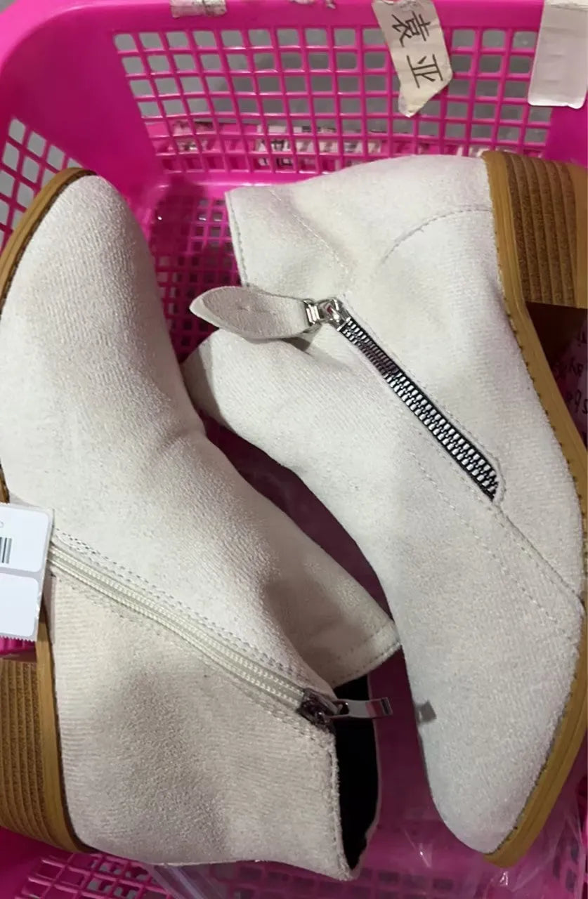 Women's beige suede chunky heel ankle boots with a side zip fastening, shown on a neutral background.