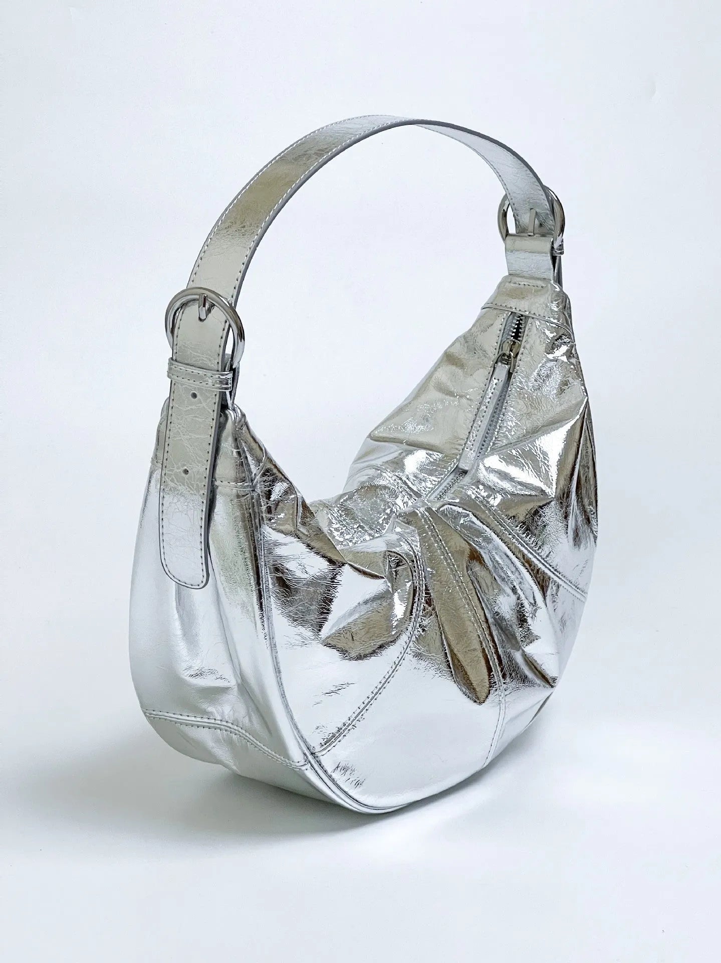 Women's soft cowhide leather dumpling-shaped shoulder bag in black with double straps and sandwich pockets.