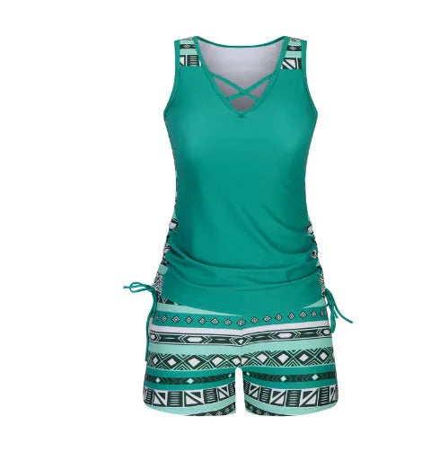 Women's floral printed two-piece swimsuit with sleeveless top and matching shorts in blue or green