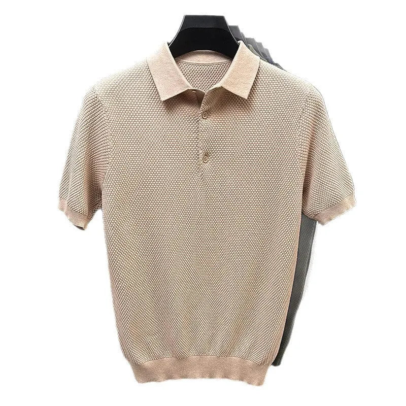 Man wearing a loose fit short sleeve cotton sweater in grey, showing the pullover style and relaxed silhouette.