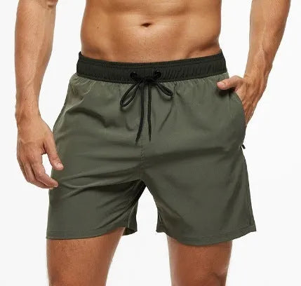 Men's blue fitness shorts with stitching waist detail, drawstring, and multiple pockets for gym workouts