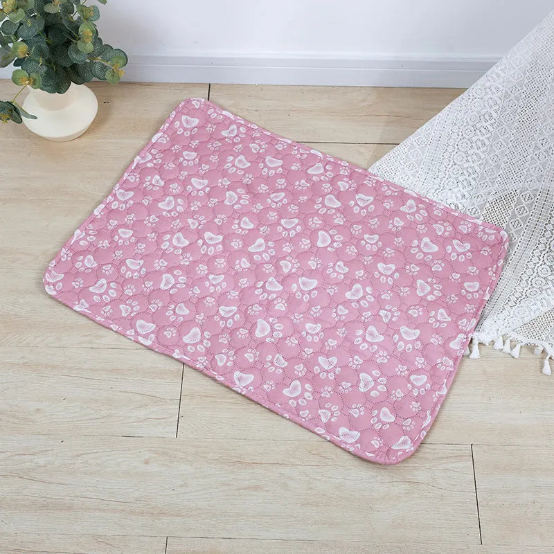 Reusable washable pet urine pad with colourful animal print and waterproof non-slip backing.
