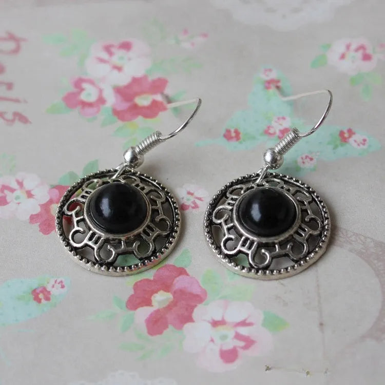 Handmade Miao silver turquoise earrings with geometric flower disk design and ethnic patterns
