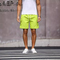 Men's loose fit work shorts in fluorescent green and army green colours with straight leg design