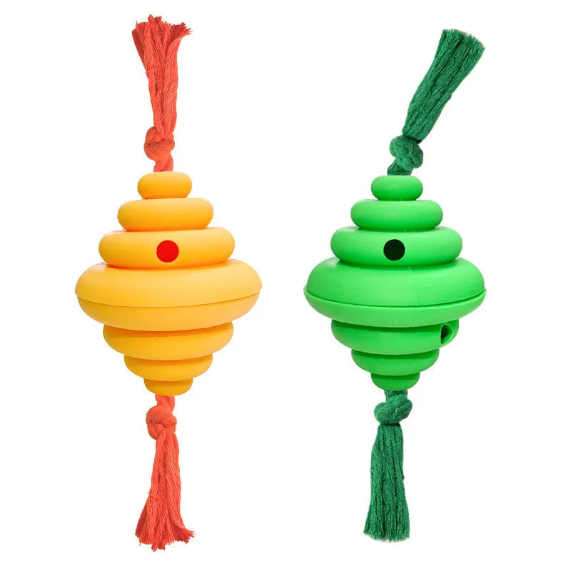 Green and yellow silicone dog ball with rope handle for tug-of-war and treat dispensing