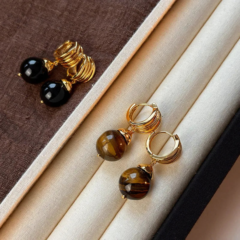 Tigereye geometric earrings with gold plating in brown or black colours featuring circular French retro design
