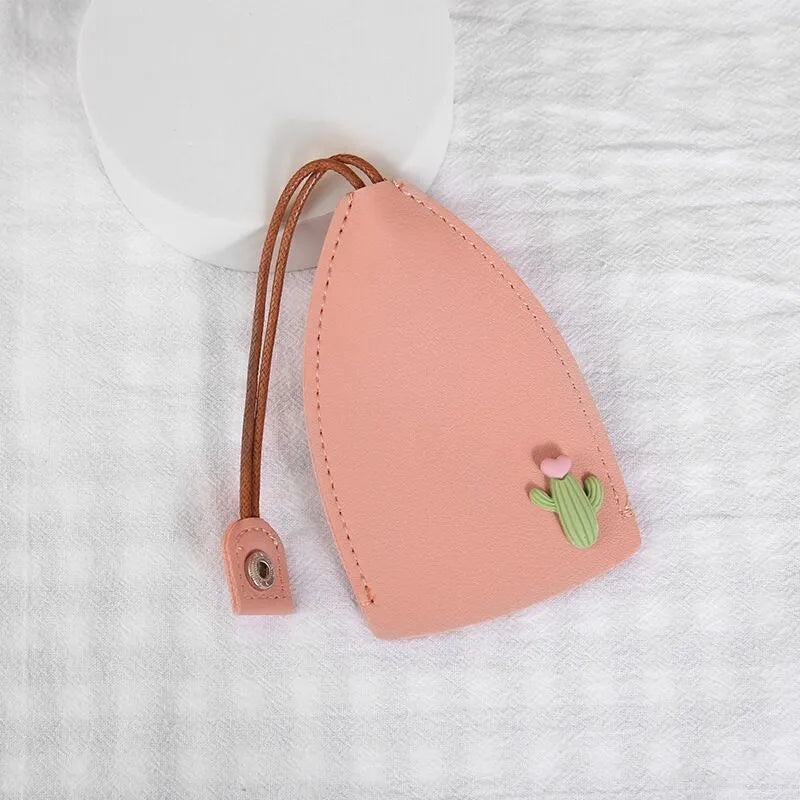 Cartoon pull-out key case in PU leather with colourful design, showing compact 14cm by 7.5cm dimensions
