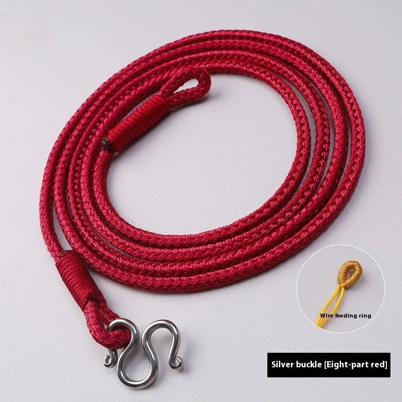 Gold and silver Thangka Peace Buckle jewellery with gem inlaid pendant on imitation pearl, showing pull ring.