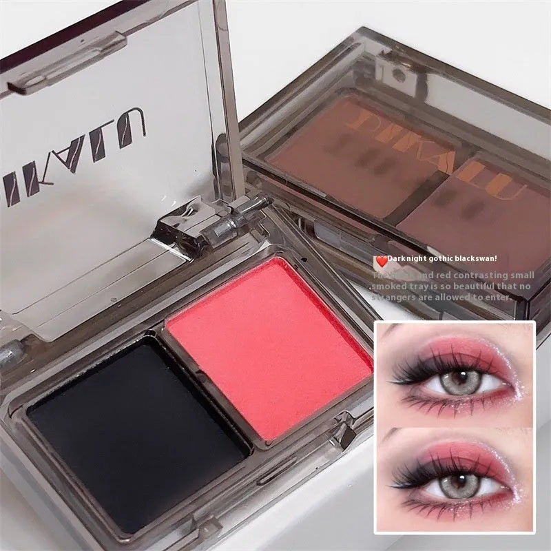 Cool two-tone eyeshadow palette open showing pink and black matte and shimmer shades for punk makeup.