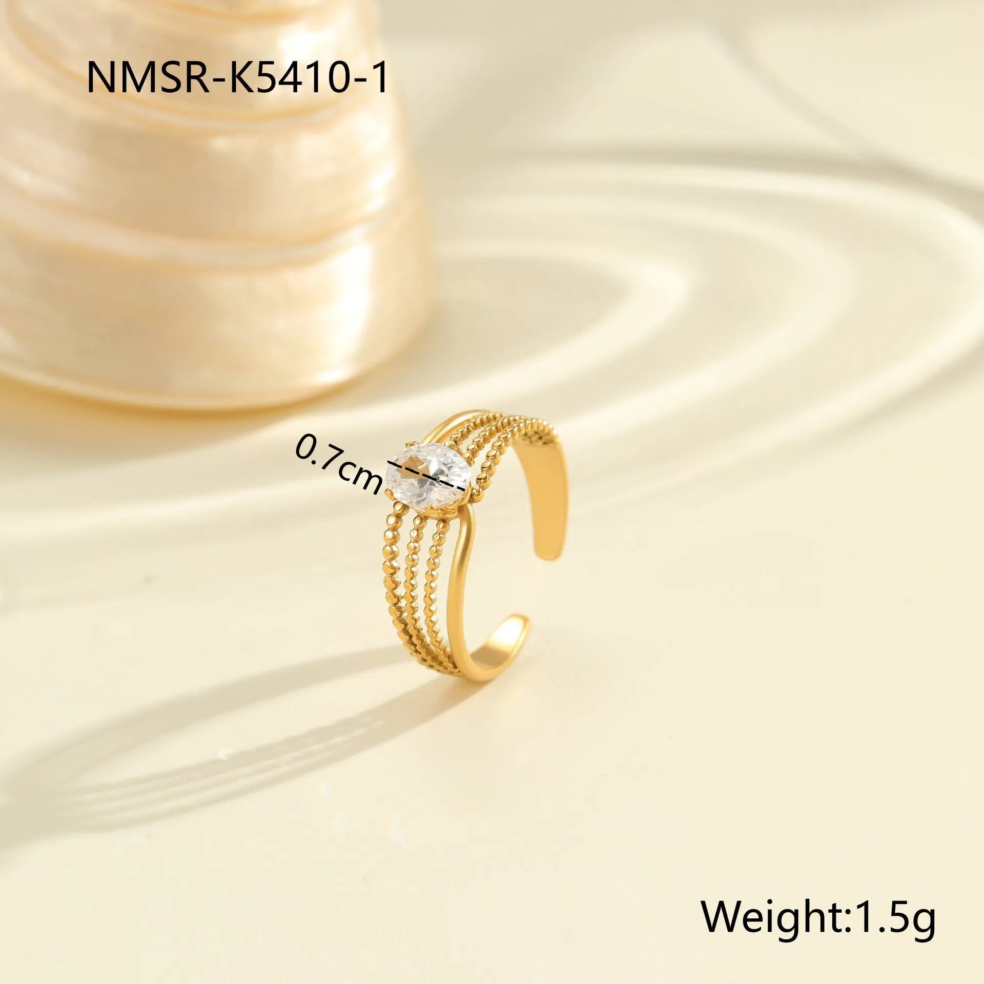 Gold-coloured stainless steel open ring with zircon stones in a geometric heart design.