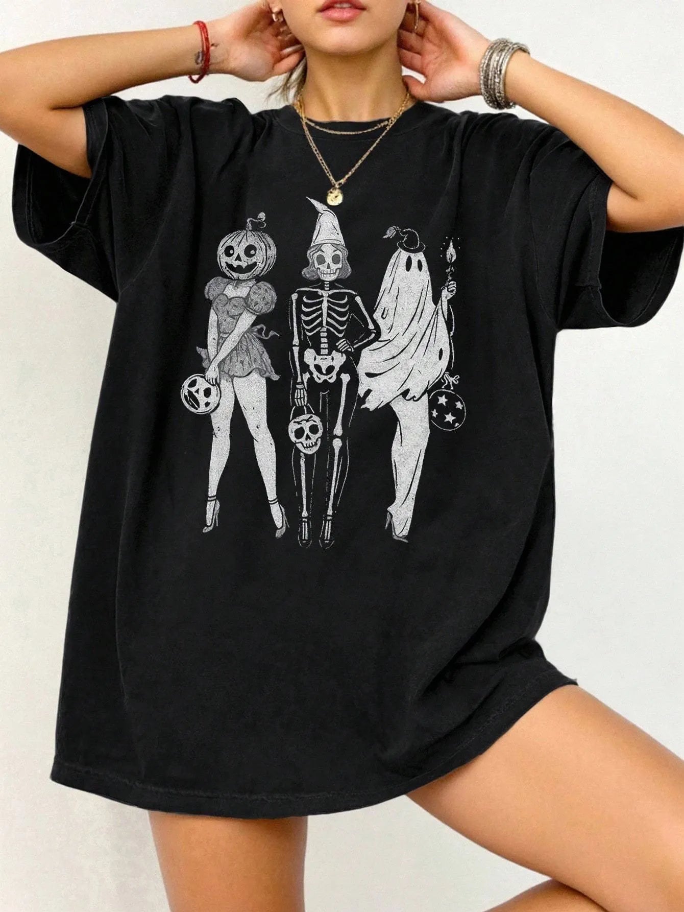 Loose fit cotton short sleeve T-shirt in black, green, grey, or orange on a hanger