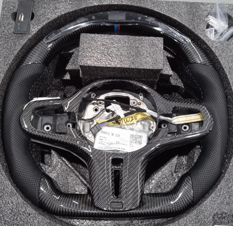 Black carbon fibre sports steering wheel with LED display for BMW X3 and X5