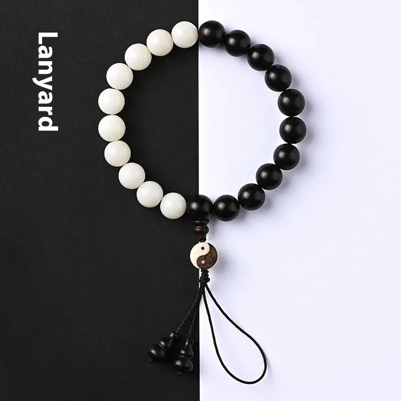 White and blackwood bead bracelet in eight-diagram pattern with natural bodhi seeds