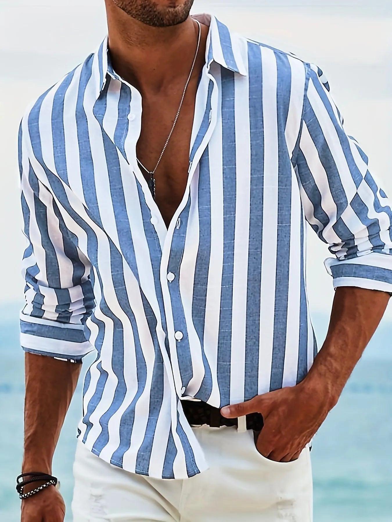 Men's loose striped long-sleeved cardigan shirt in British style on a hanger