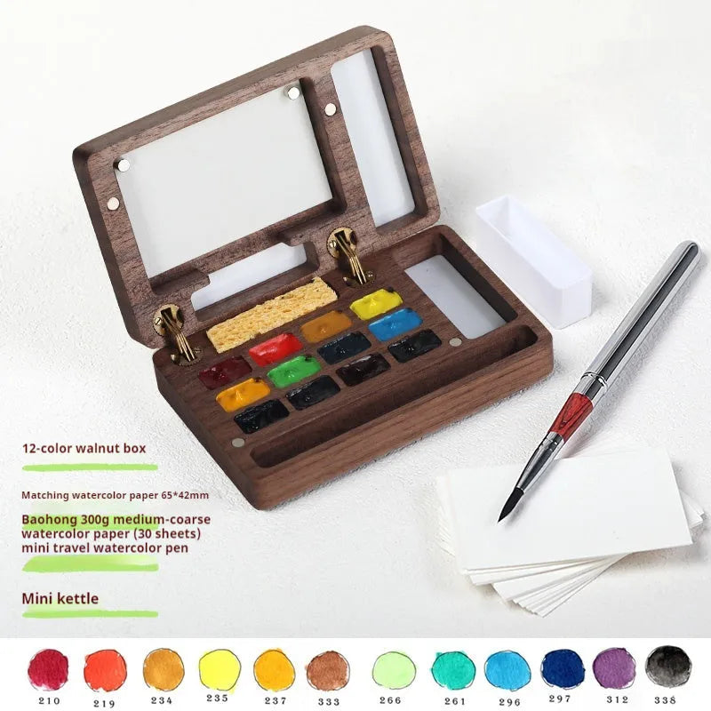 Mini wooden walnut watercolour paint box open showing pigment pans with choice of Schmincke, Holbein, Picasso, or Moonlight colour sets.