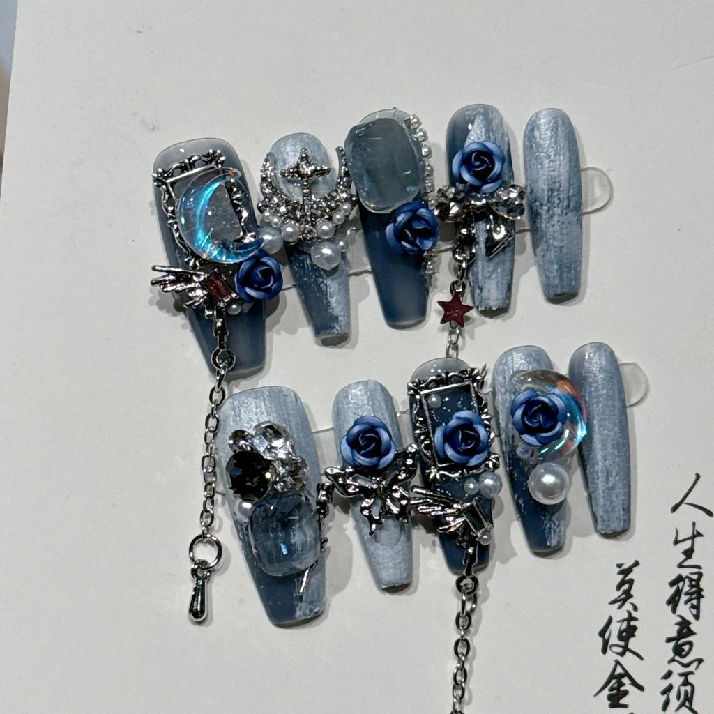 Wearable plastic nail armour suit in heavy industry night blue with ornate rose and tulip floral pattern.