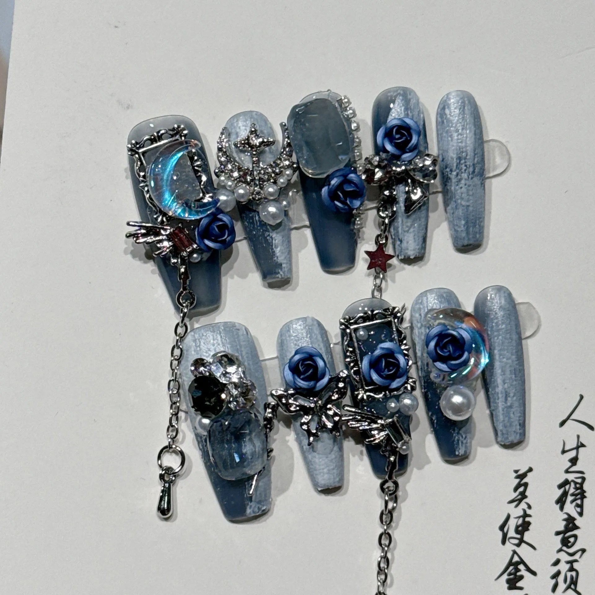 Wearable plastic nail armour suit in heavy industry night blue with ornate rose and tulip floral pattern.