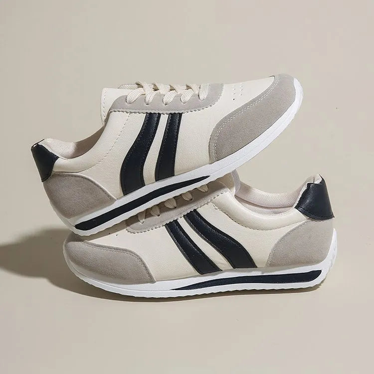 Blue low top lace-up sneaker with soft rubber sole and PU mesh upper