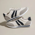 Blue low top lace-up sneaker with soft rubber sole and PU mesh upper