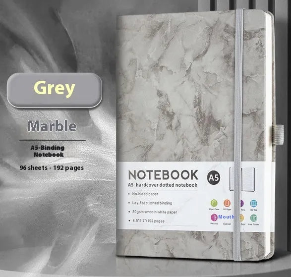A5 PU leather notebook with strap closure, open to show horizontal line ruled pages.