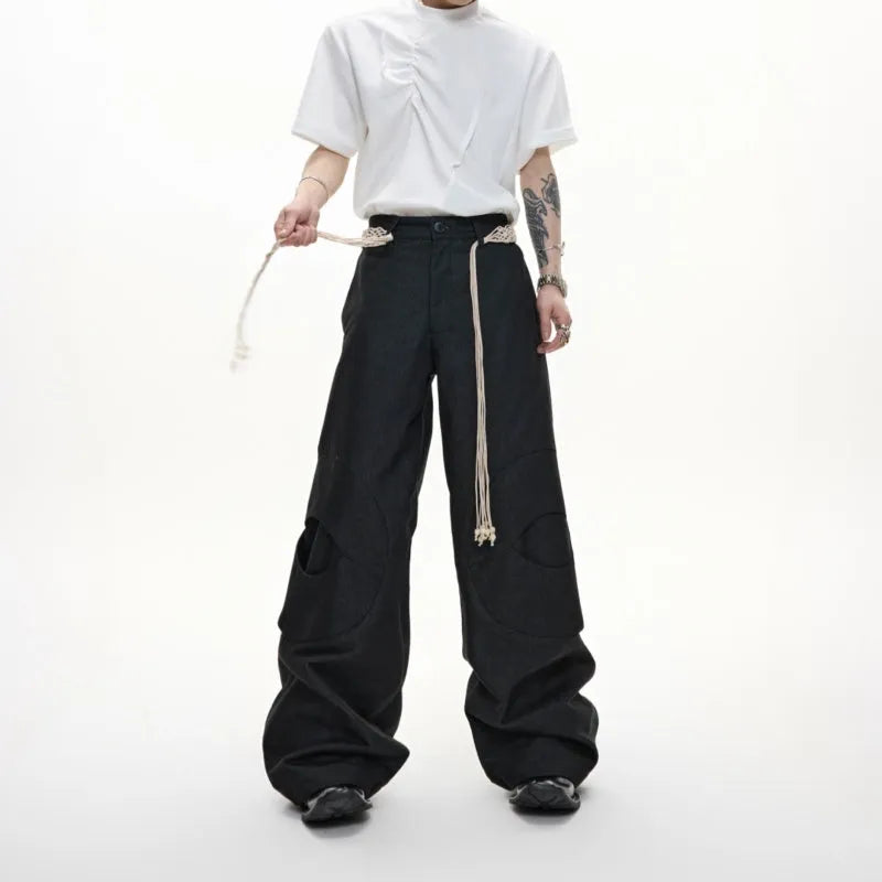 Men's dark blue straight-leg cotton jeans with heavy stitching on belt and zip decorations, shown in a loose fit.