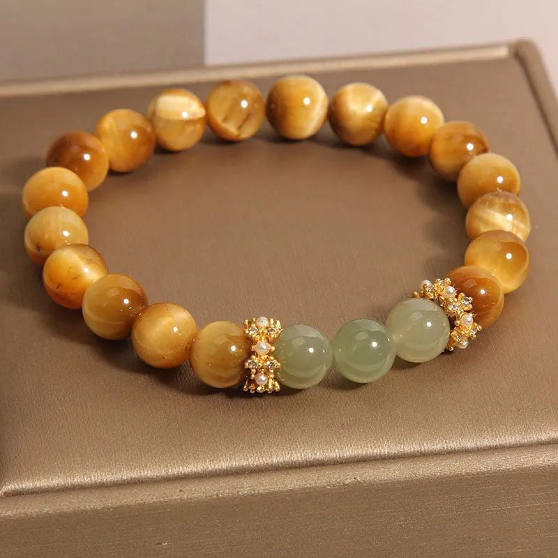 Natural yellow tiger's eye and Hetian jade bracelet with U-shaped bead design showing golden gourd pattern