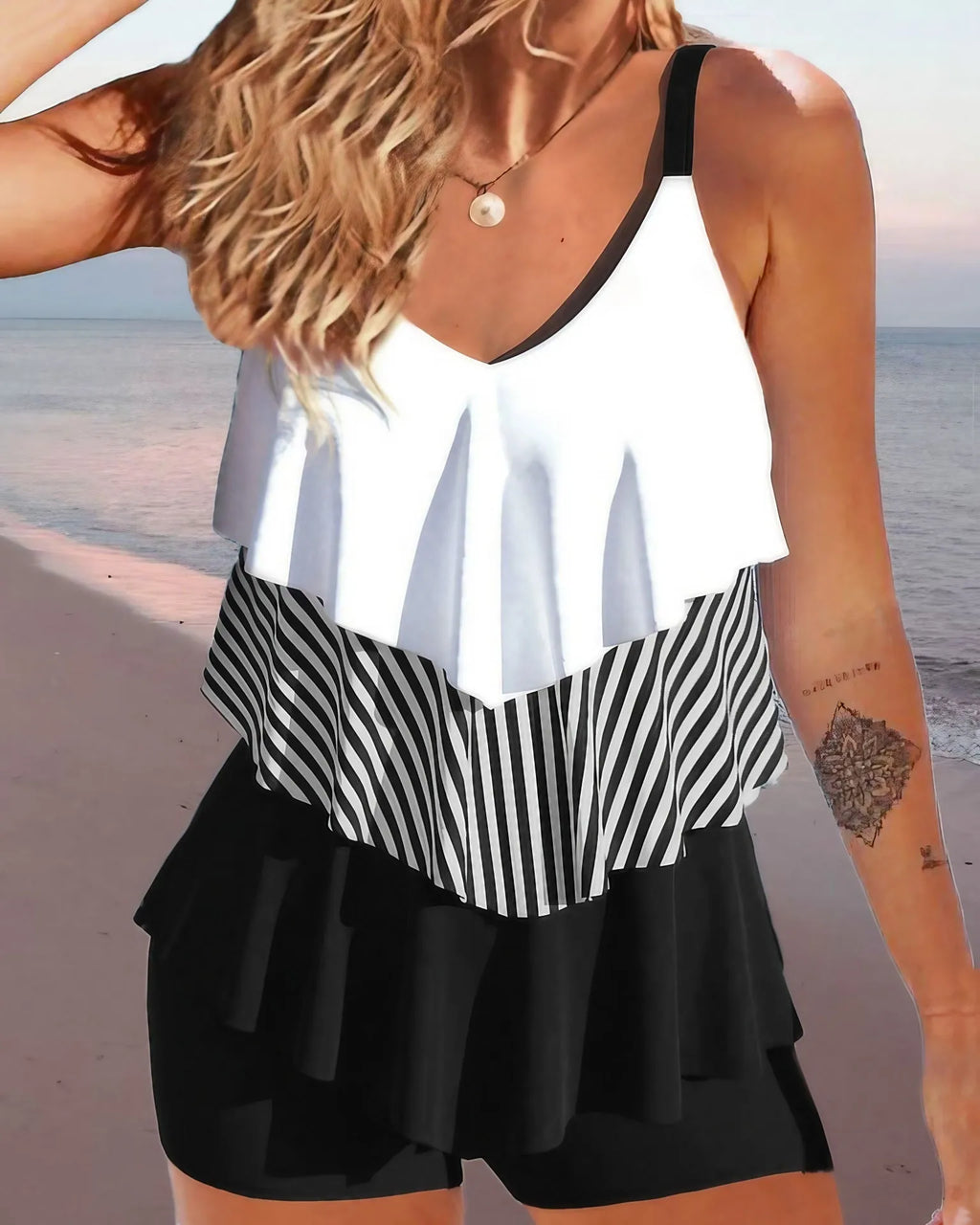 Women's sleeveless bikini swimsuit with spaghetti straps and ruffle detailing in floral pattern