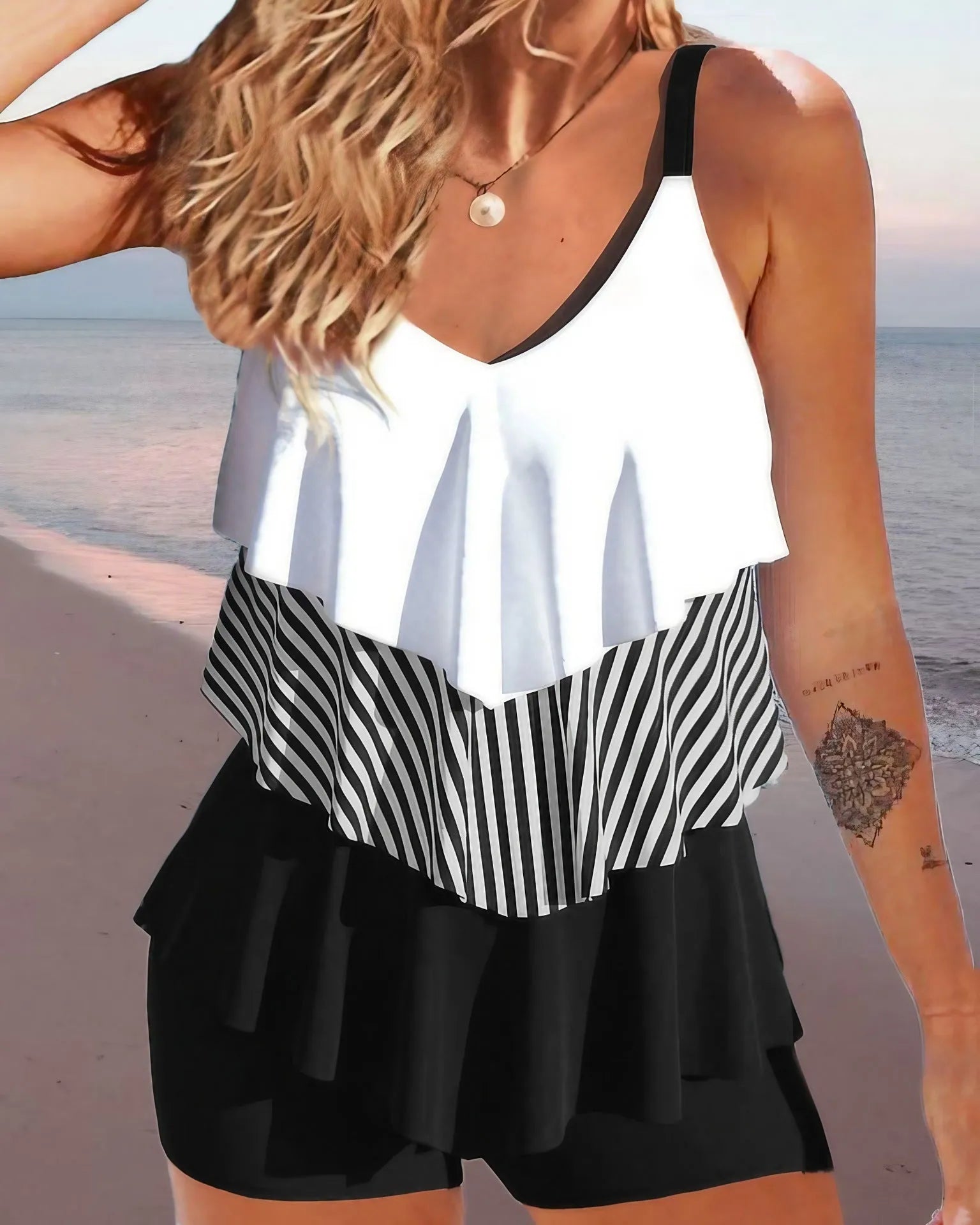Women's sleeveless bikini swimsuit with spaghetti straps and ruffle detailing in floral pattern