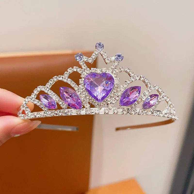 Children's metal alloy crown headdress hairband in pink, light blue, or light purple with crystal decoration.