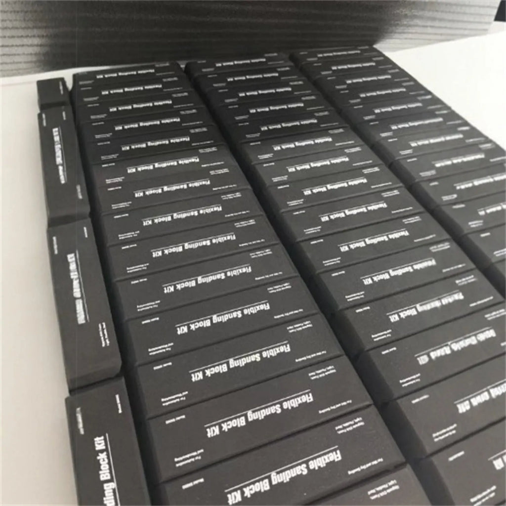 Set of seven black EVA frosted metal blocks arranged for workshop support and material positioning