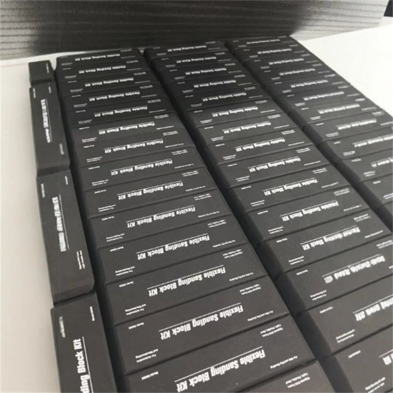 Set of seven black EVA frosted metal blocks arranged for workshop support and material positioning