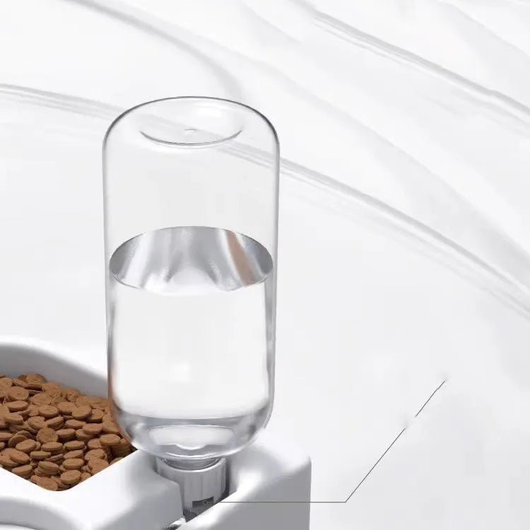 White indoor pet water fountain for cats and dogs on a kitchen floor