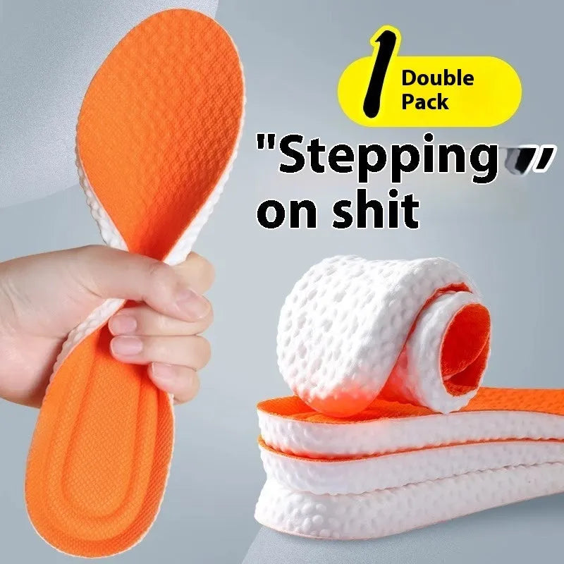 Grey, black, and orange PU foam sports insoles on a white background, showing trim-to-fit edges.