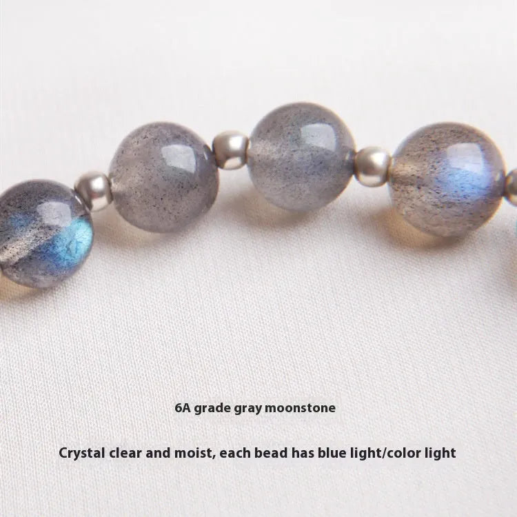 Women's silver bracelet with grey moonlight finish, 7.5mm lime and strawberry crystals, zodiac animal motif, and honeysuckle charm.