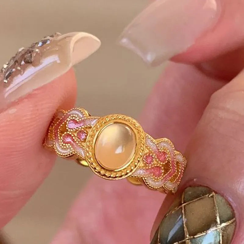 Women's pink crystal enamel ring with open mouth adjustable design and geometric shape.
