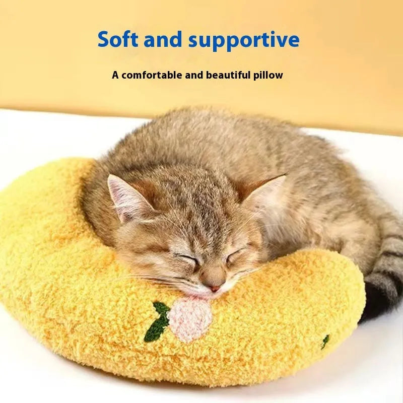Blue U-shaped cloth pet sleeping mat for cats with neck support pillow in a question mark design.