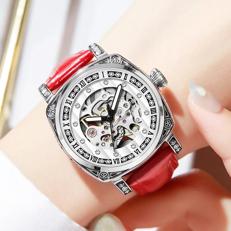 Leather strap mechanical watch with luminous hands on a wrist, showing black dial variant.