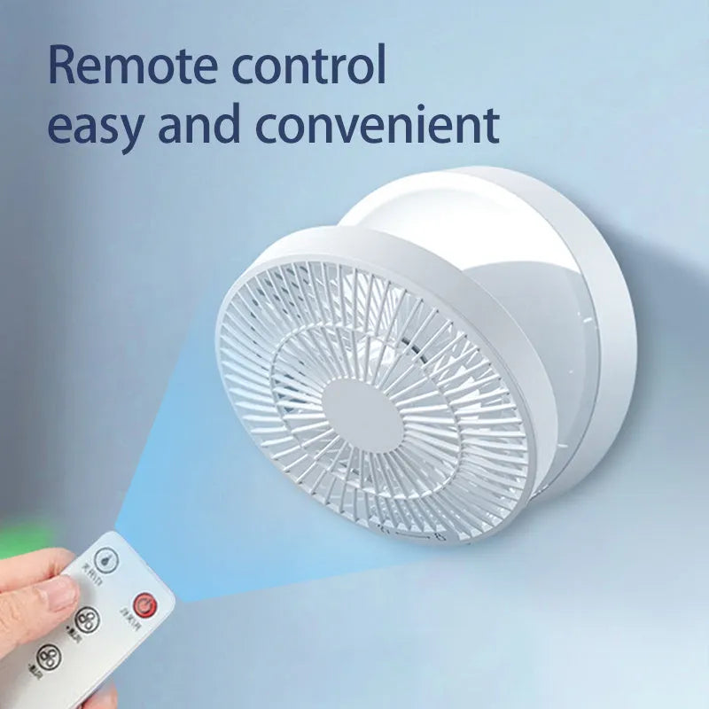 White portable USB rechargeable folding desk fan with remote control on wooden surface