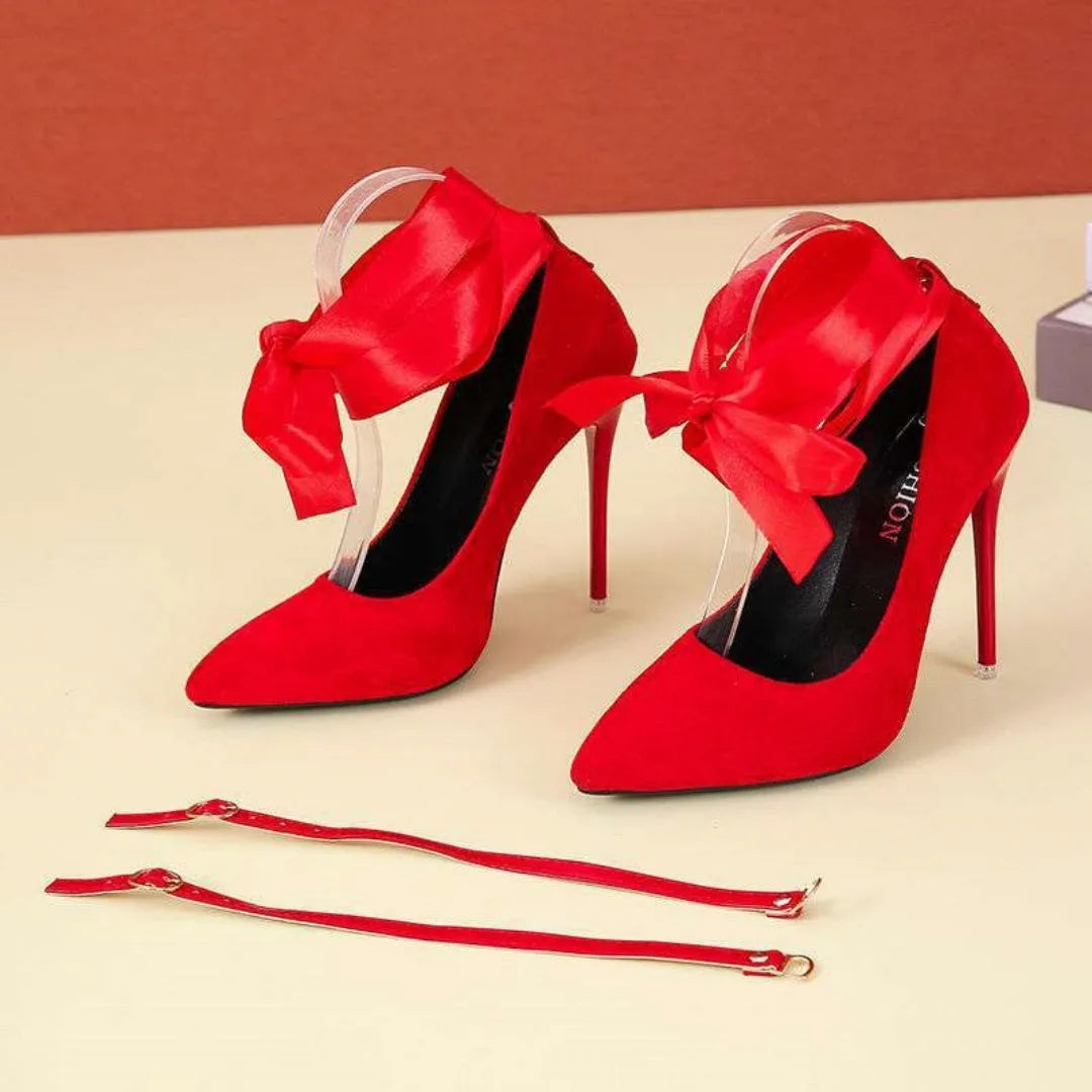 Black platform heel with shallow open toe and thin lace straps on a 12cm heel.