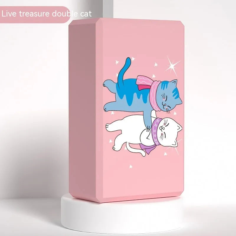 High-density EVA yoga block in violet colour next to a pink block with a cartoon print design.