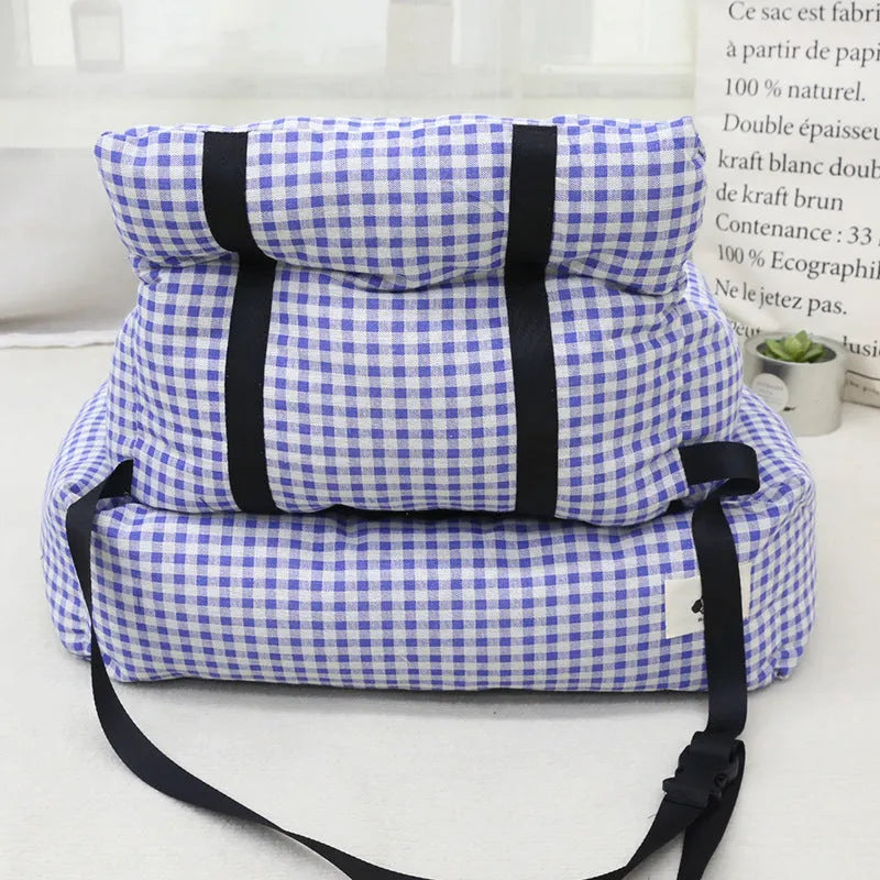 Blue plaid fabric car-mounted dog travel nest for small or medium dogs on a car seat