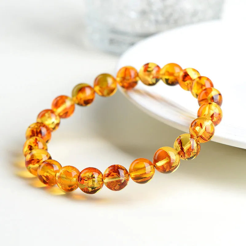 Natural yellow piebald amber bracelet with flower spot pattern for water purification
