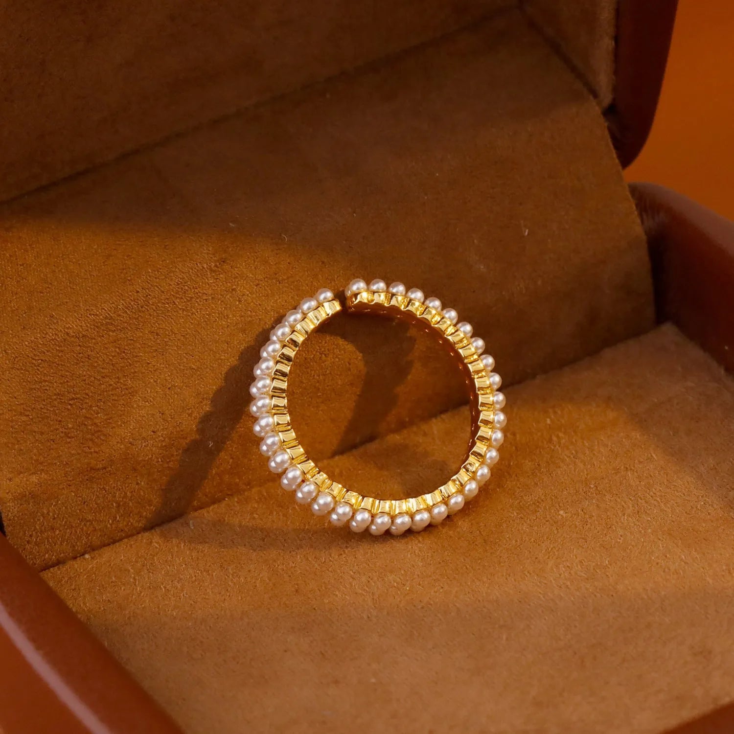 Gold electroplated open mouth ring with geometric design and round elements for women