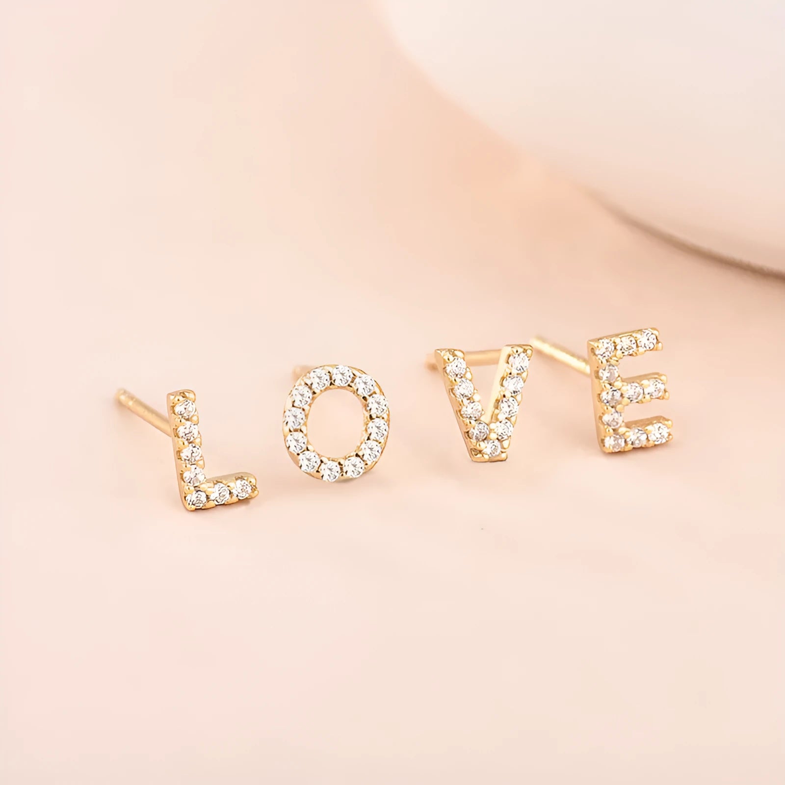 Brass gold plated alphabet letter earrings showing zircon stones on copper base with 26 English letters available
