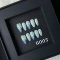 HAILANG blue plastic wearable shell nail tips in sizes XS, S, M, L on a white background.